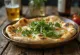 Naan met geitenkaas en rucola