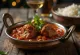 Klassieke rogan josh, geserveerd met mals lamsvlees in een dieprode kruidige saus