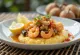 Polenta met zeevruchten, romige basis geserveerd met topping van zeemix