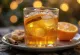 Cider met sinaasappel en honing in een glas
